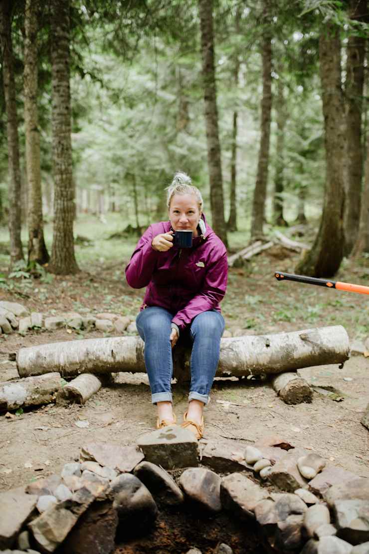 host-sipping-coffee-in-forest