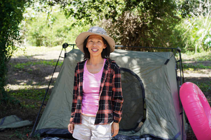 host-smiling-by-tent