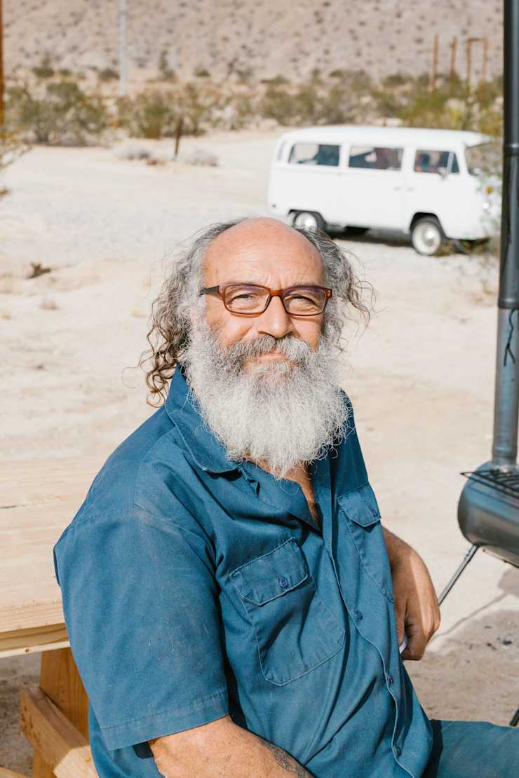 host-smiling-in-desert