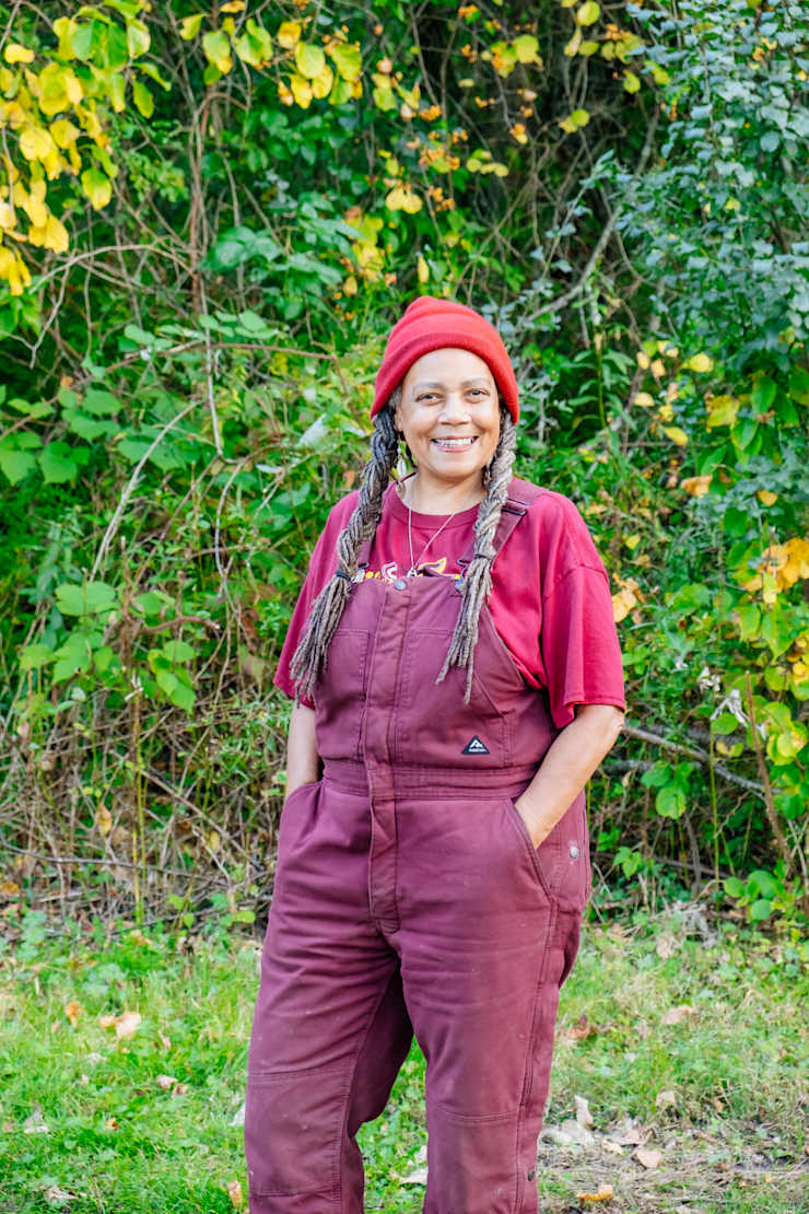 host-smiling-in-overalls
