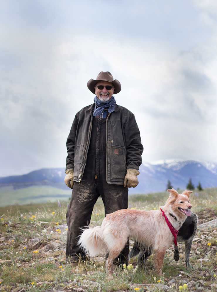 rancher-with-dog-on-mountain
