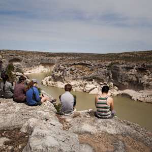 Students from the University of Houston's Outdoor Adventure program taking a break to enjoy the view on the Rim Trail.