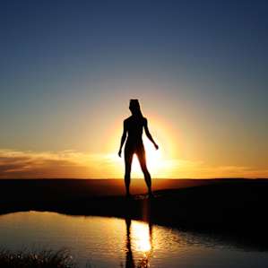 This beauty pauses for a moment upon reaching the summit to take in the equally beautiful sunset.