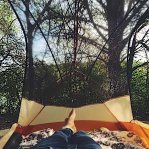 Campsite 28 is quietly tucked away under a canopy of bird-filled trees.