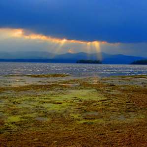 The best sunsets over the Adirondacks - The beach at Button Bay Campground.