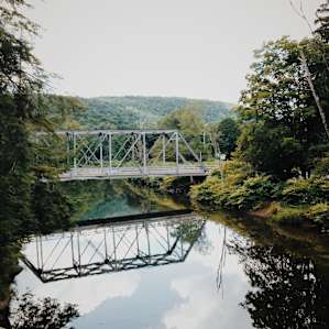 Beaverkill offerts stunning 360 views of the mountains with quaint sights like this iron bridge on the way to the camp.