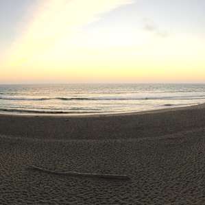View of the beach facing the Pacific Ocean at sunset