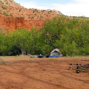 A communal pad makes up the primitive campground with sites along the perimeter. Photo by Lisa Rawlinson