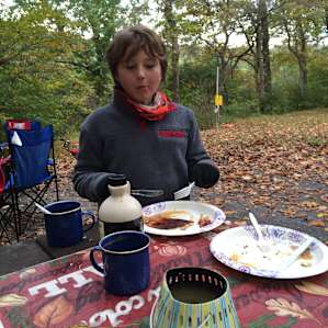 Enjoying breakfast and hot cocoa on a chilly morning.