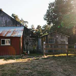 There is a large barn located to the right as you drive onto the property. The owners hosts town events within this space. There's even a horseshoe area!
