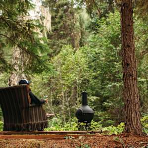 A sitting area above the creek just outside of the RV.