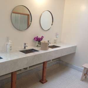 Gorgeous bathrooms with heavenly smelling soap. The white tile can get a bit muddy, but they do a good job keeping it mopped and the penny tile is so adorable.