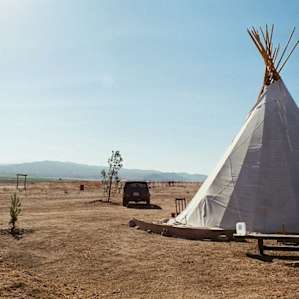 Beloved Jeep and our Tipi for the night. No water on the grounds so we brought our own. I bench set up outside we made a little hand washing station at.