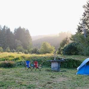 Looking west toward the sunset over more of the wetland and where we decided to pitch our tent. We used a large cable spool as table!