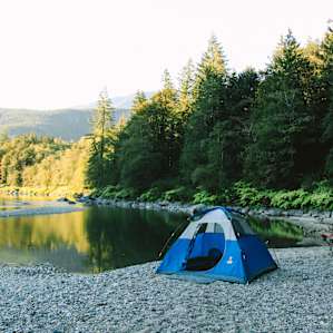 If you pitch your tent down on the landing you can see the sunset looking north over a mellow eddy in the river.