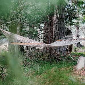 There is even a cool little hammock under the trees behind the meadow view tent deck to lounge on.