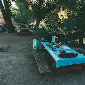 Each site has a picnic table, water spigot and an electric hook up for a camper or RV.
