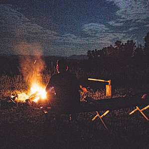 people campfire camper