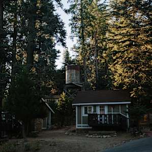 Rad old water tower among some of the cabins as the sun rises!