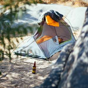 The River Campsite has a flat sandy area that can be used to pitch a tent if you don't want to sleep on the suspended platform bed.