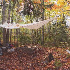 As the rain came in we put a tarp up over the kitchen and fire pit.
