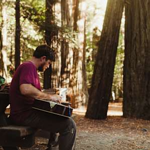 Playing music and relaxing at our campsite.