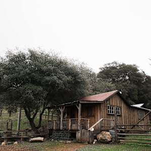 View of the cabin and corral from the barn