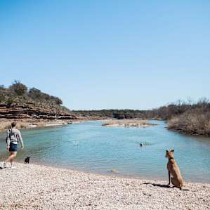 Skipping rocks on the Llano River. This is taken from the gravel bar on the other side of the river, which is easily accessible.