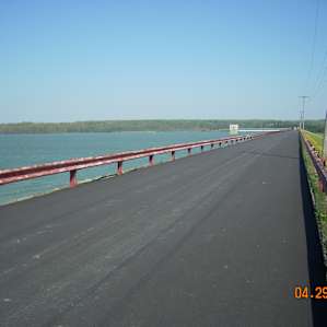 the view of the lake and reservoir from the top of the rolled-earth dam