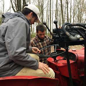 Learning how to drive an old tractor on the farm