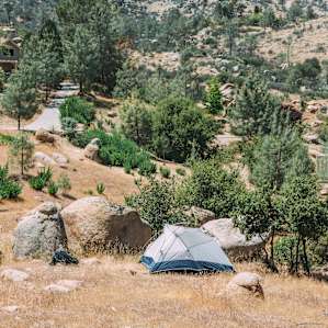 There are a few flat spots in the property to pitch your tent.