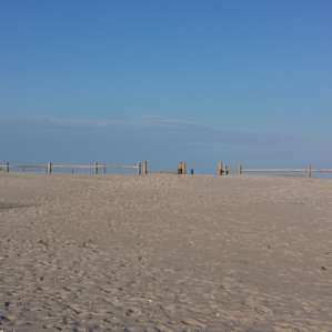 The beach, just beyond the boardwalk.