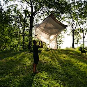 Shaking out the tent in the morning glow.