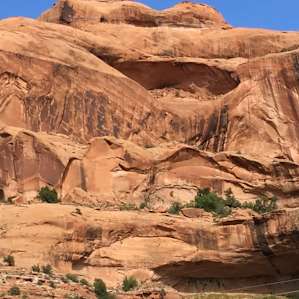 Campground views include spectacular cliffs and a small arch.