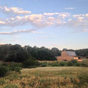 Sunrise view of the barn from the campsite.