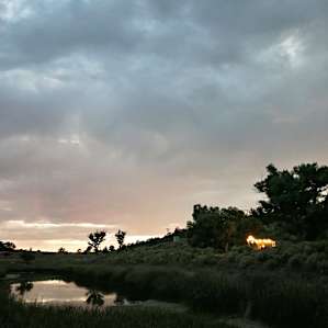 The Lake Cabin's twinkle lights gleaming at dusk