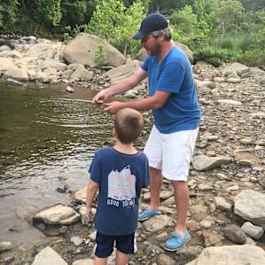 Skipping stones on the banks of the Gauley River, just up the road.