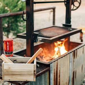outside grill also serves as a fire pit