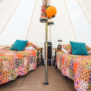 This tent comes with everything you could want: beds, beanbag chairs, lanterns, power, a fan and A/C.