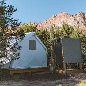 There is a solar heated shower out back but no bathroom. If you need to go, there is a park with public restrooms nearby.