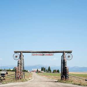 The entrance to Diamond P Ranch, with mountain ranges in the background