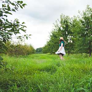 Taking a stroll in the apple orchards, which are literally right next to your site.