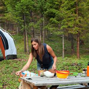 Making dinner at the conveniently located picnic table (trash cans provided on-site as well for easy trash disposal!)