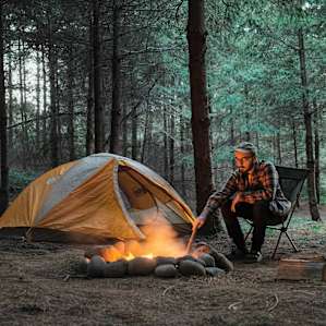 Starting the campfire for dinner.