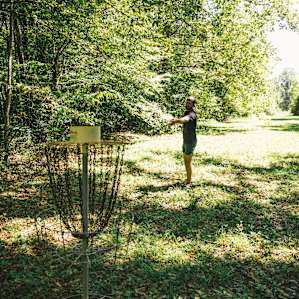 Disc golf along the field next to the trout stream