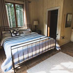 The pool house sleeps two, has a kitchen with a fridge and sink, and a bathroom with toilet and shower.