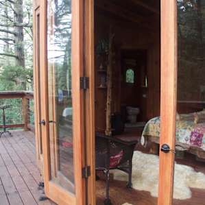 Patio, beautiful rug, and the comfiest bed with the best view you could ask for!