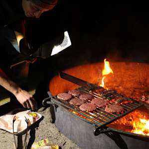 Cooking over the fire ring. There are two large grills as well.