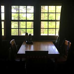 Kitchen table faces out onto the back porch with great views of the area!
