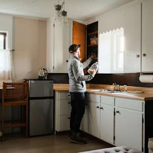 Filling the cabinets with food for later.